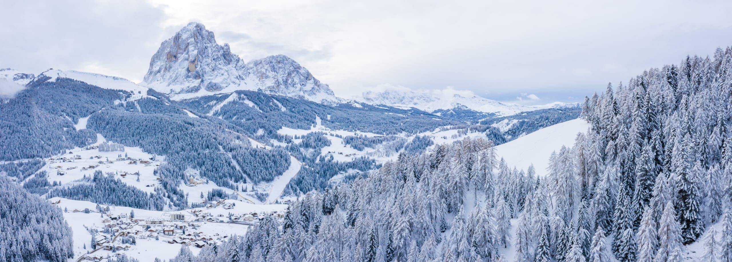 Snow-covered Alpine peaks under a clear sky