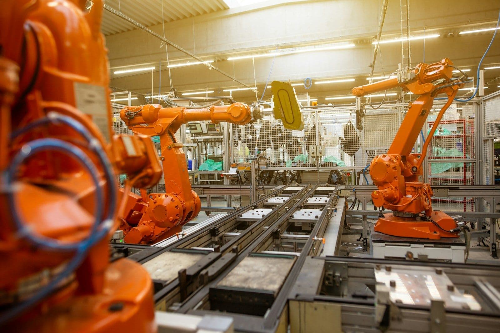 Robotic arms on an automated assembly line
