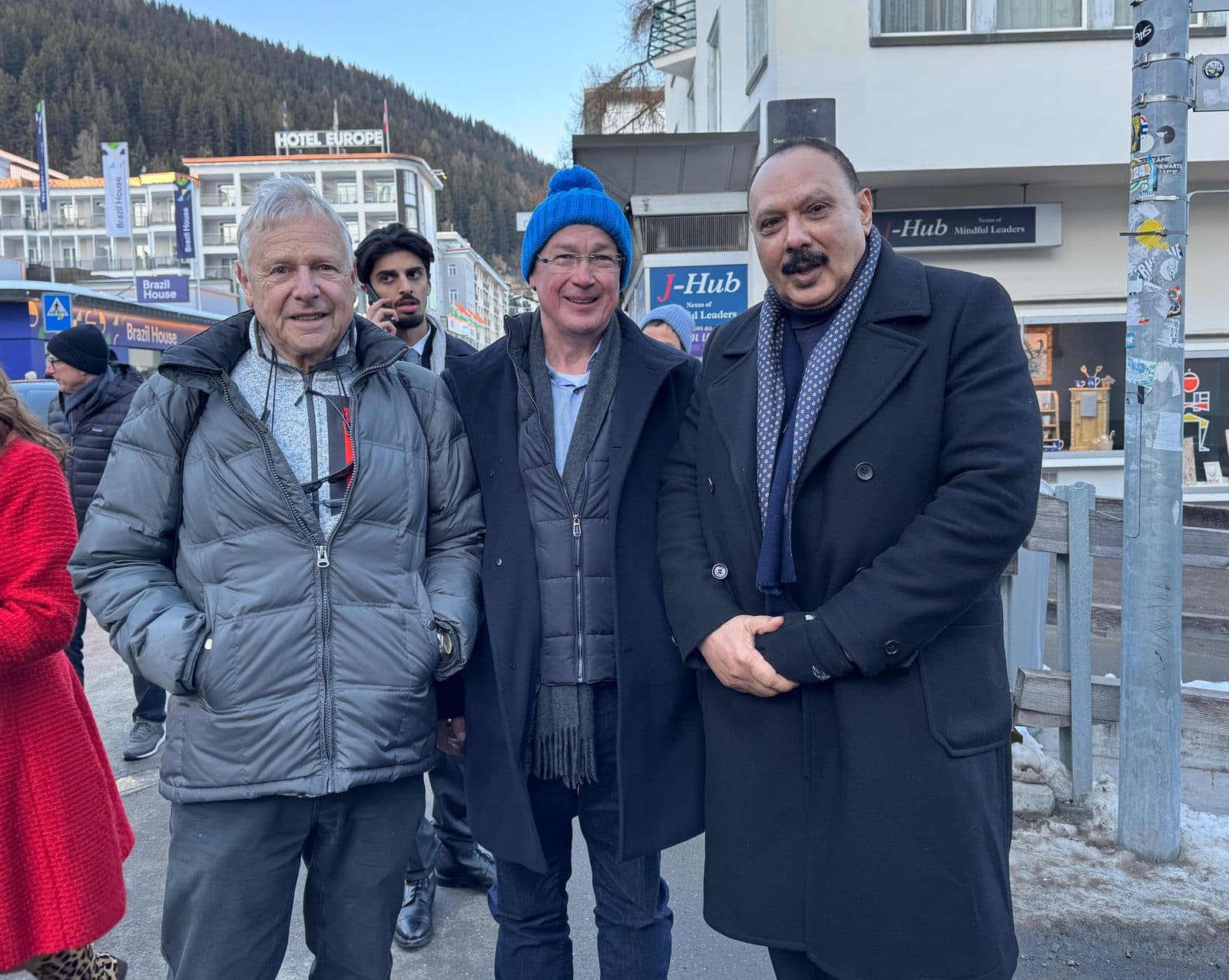 Three delegates on a snowy street in Davos