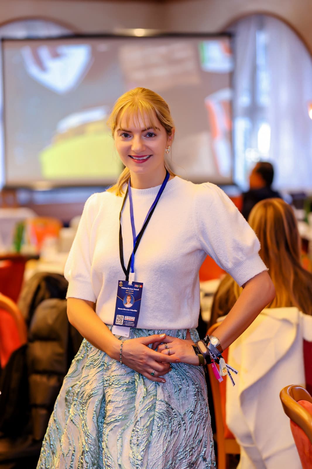 A delegate wearing her summit lanyard at the 2026 summit