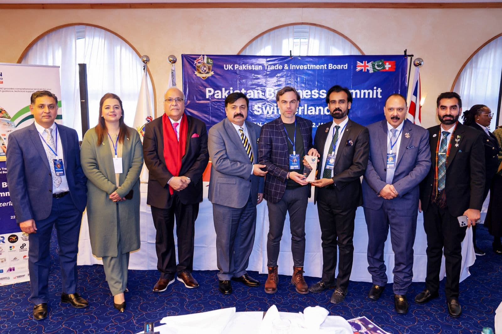 An award handed over before the summit banner