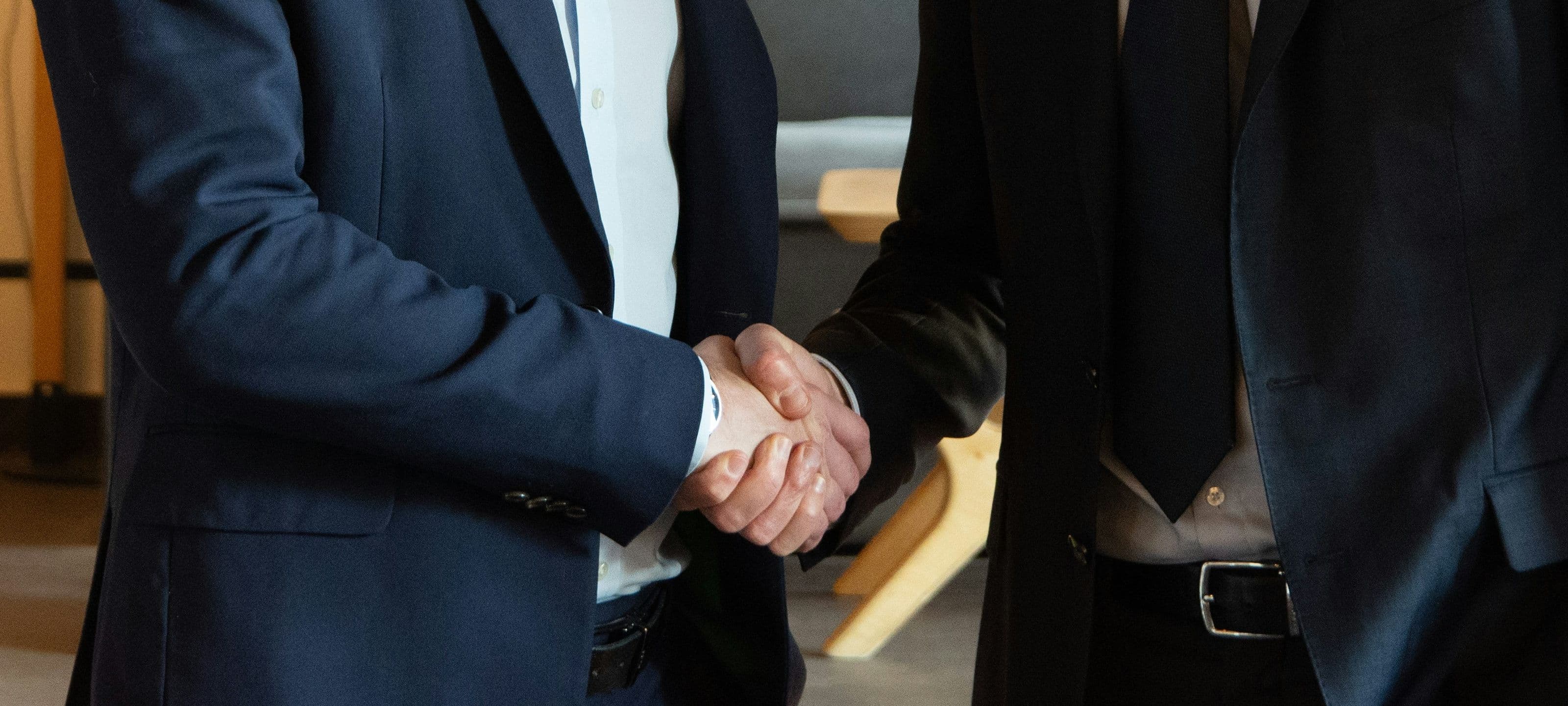 Two business people shaking hands