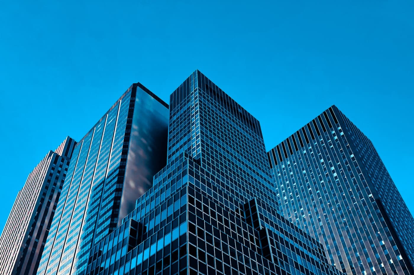 Glass office towers seen from street level